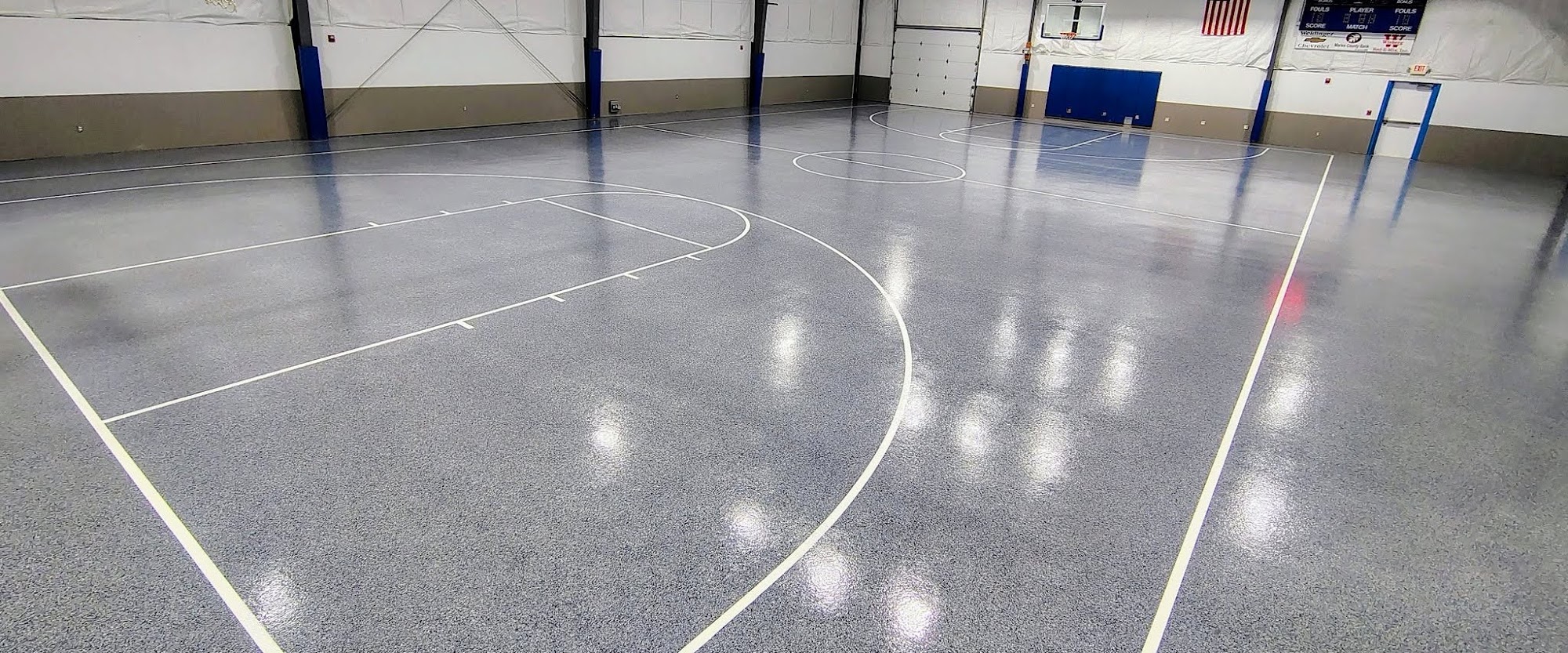 Gray flake epoxy gym floor with court lines