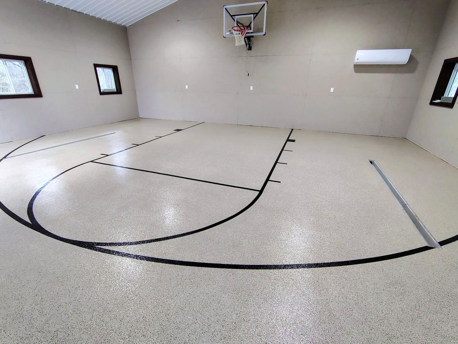 Cream flake gym floor with black court lines