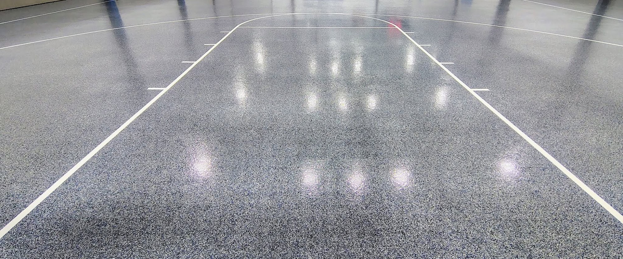 Gray flake epoxy floor with white court lines