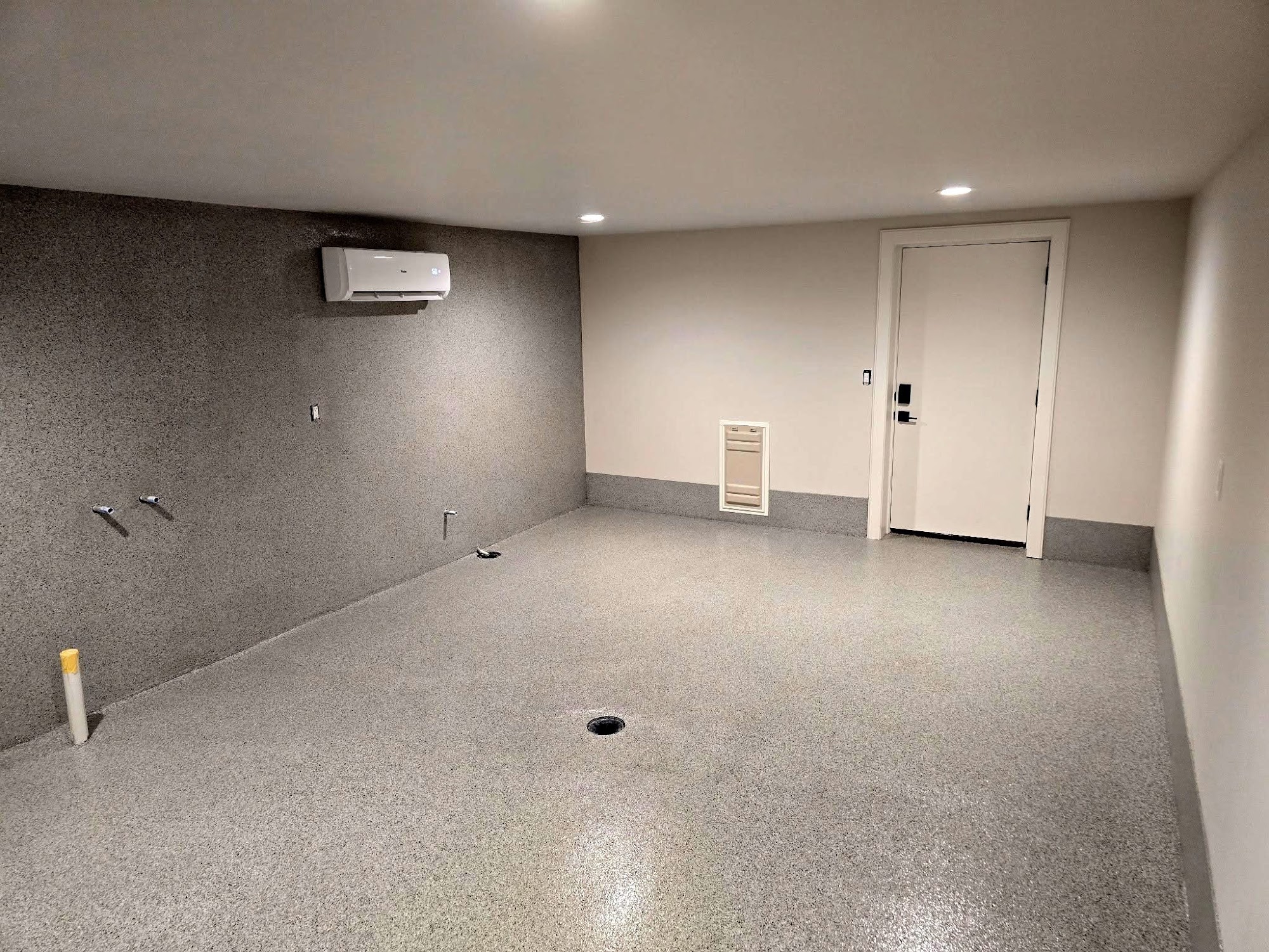 Gray flake floor with a round floor drain