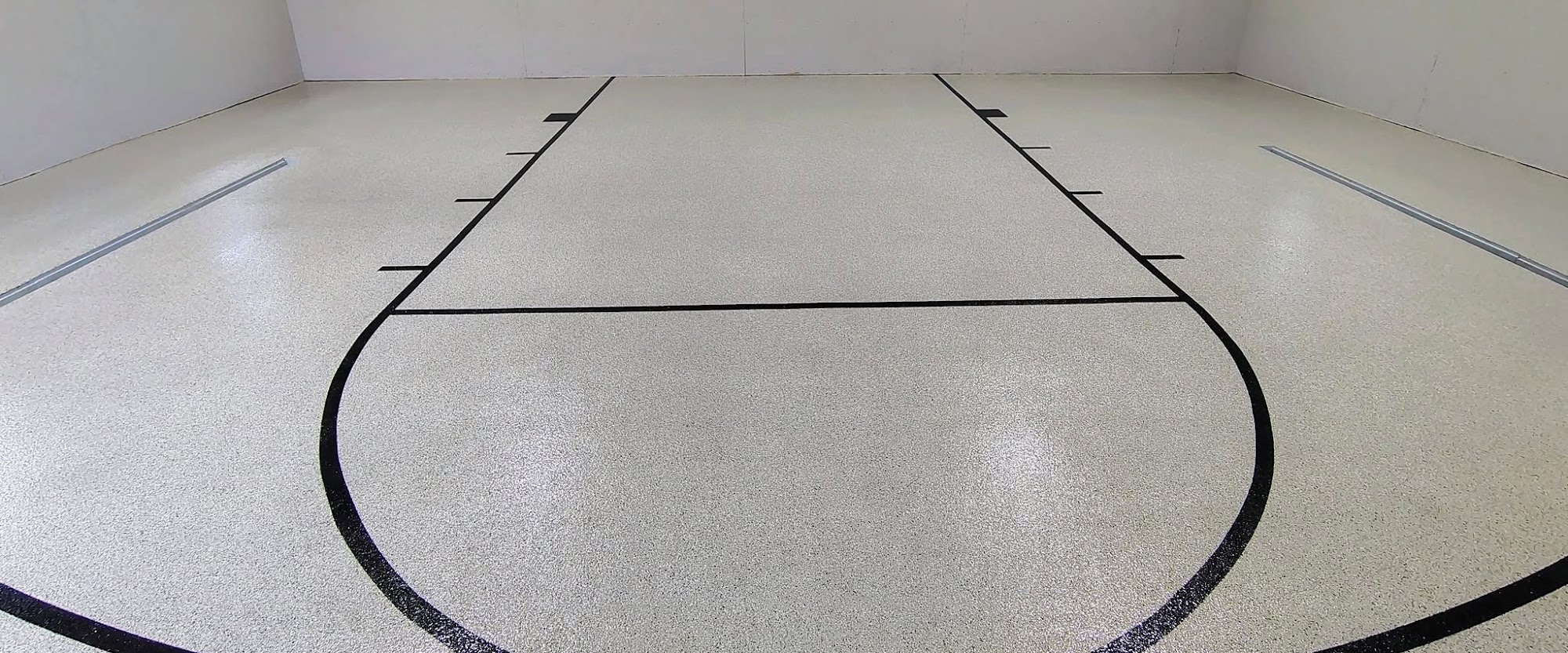 Cream flake floor with black court lines