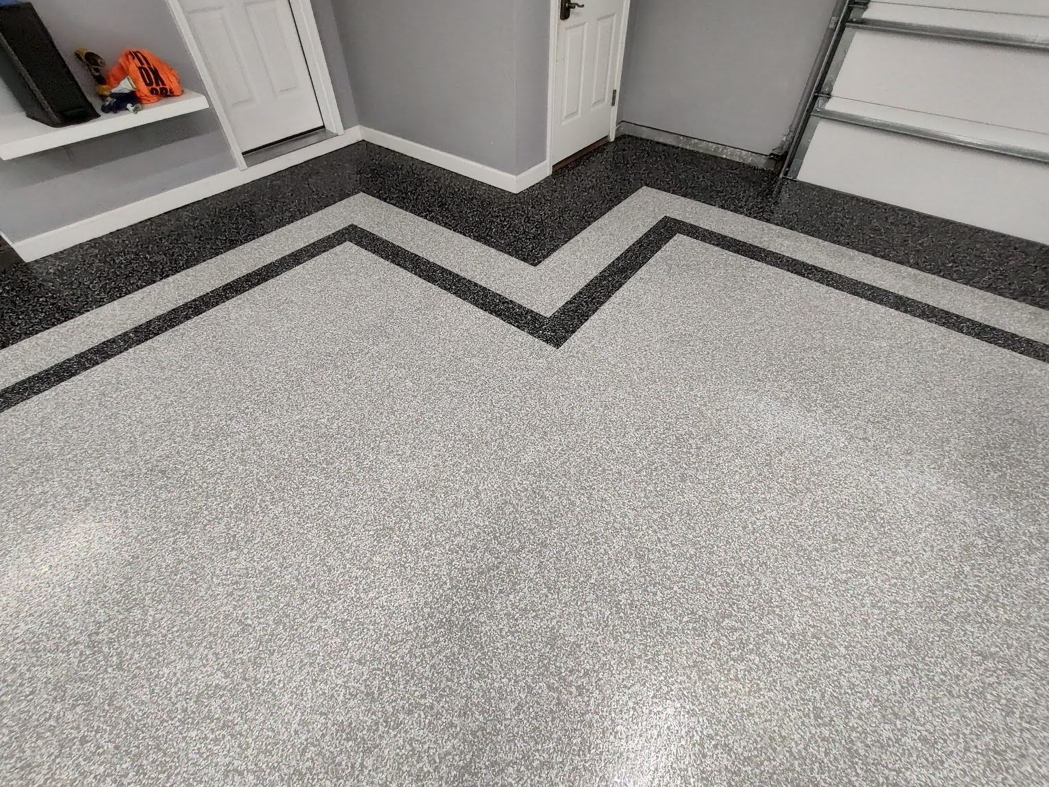 Decorative flake epoxy floor with chevron pattern design