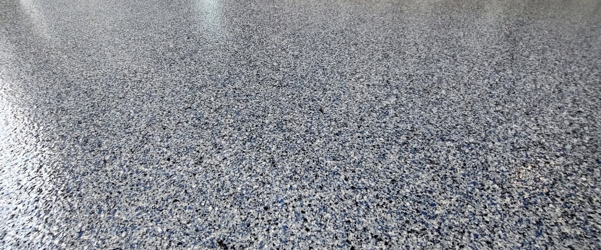 Close-up of a gray flake floor