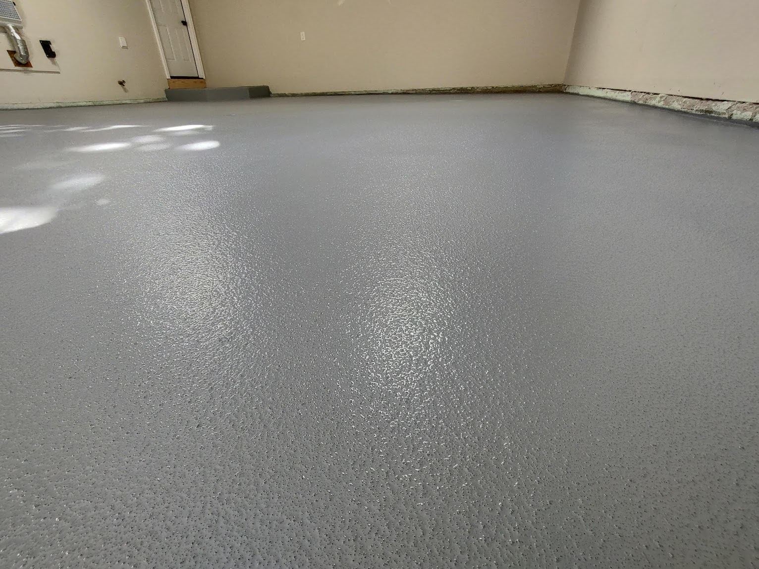 Gray quartz broadcast floor in an empty room.