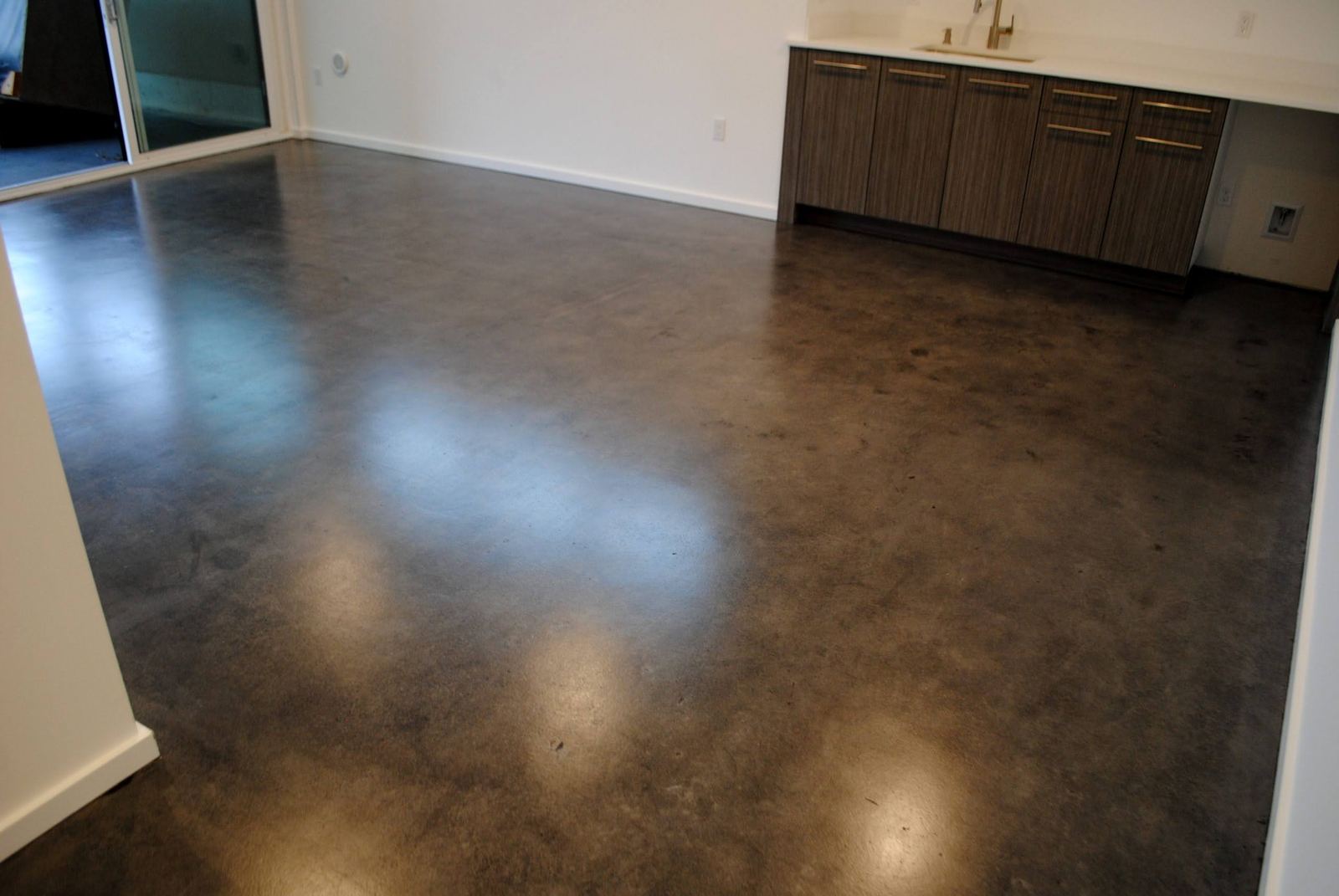 Dark brown sealed concrete floor.