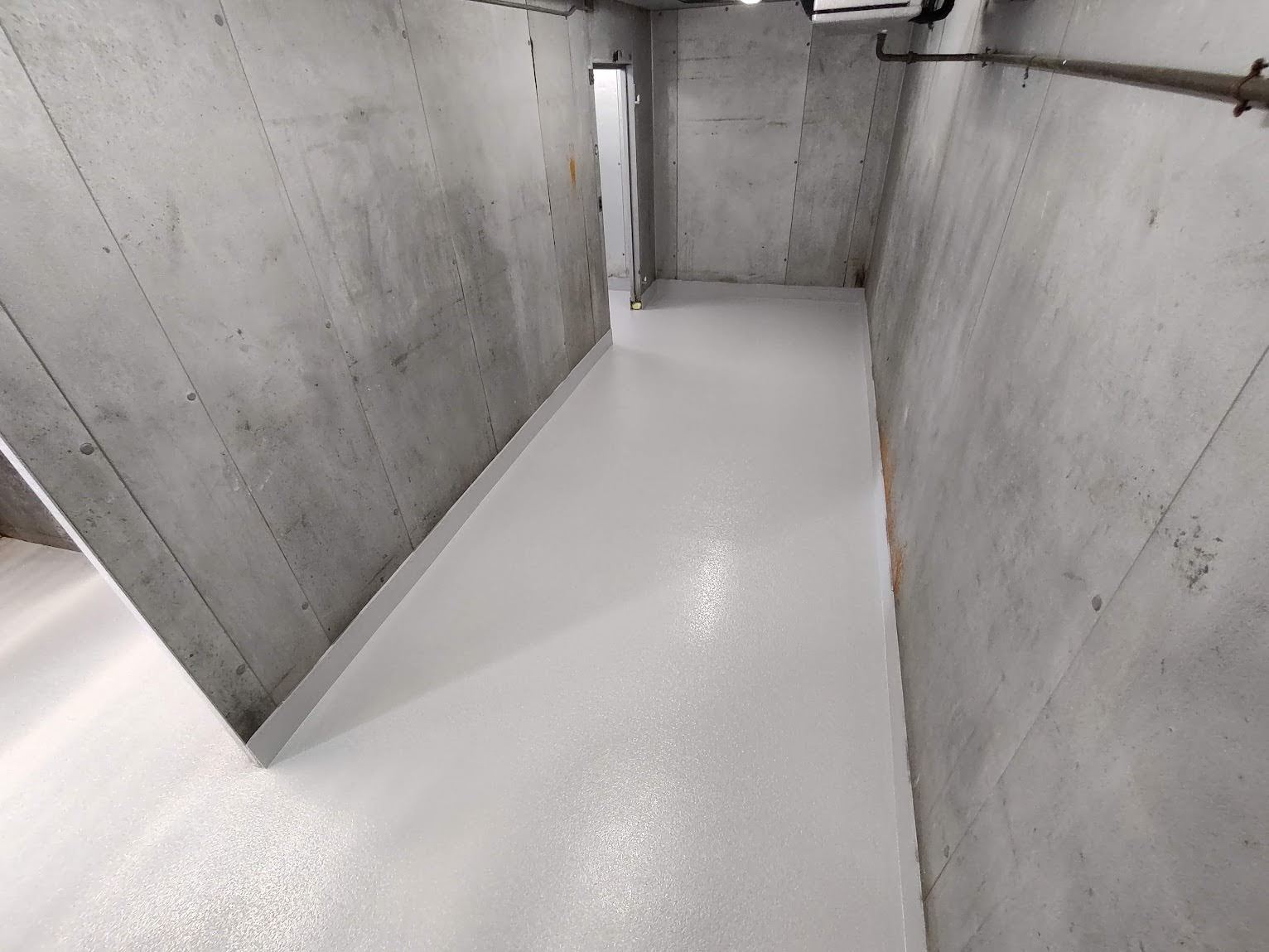 Urethane cement flooring installed in an industrial corridor